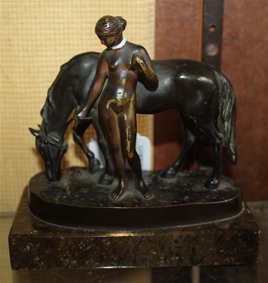 Gotthilf Jaeger (1871-1933). A bronze group of a horse and standing nude girl, overall 5.25in.
